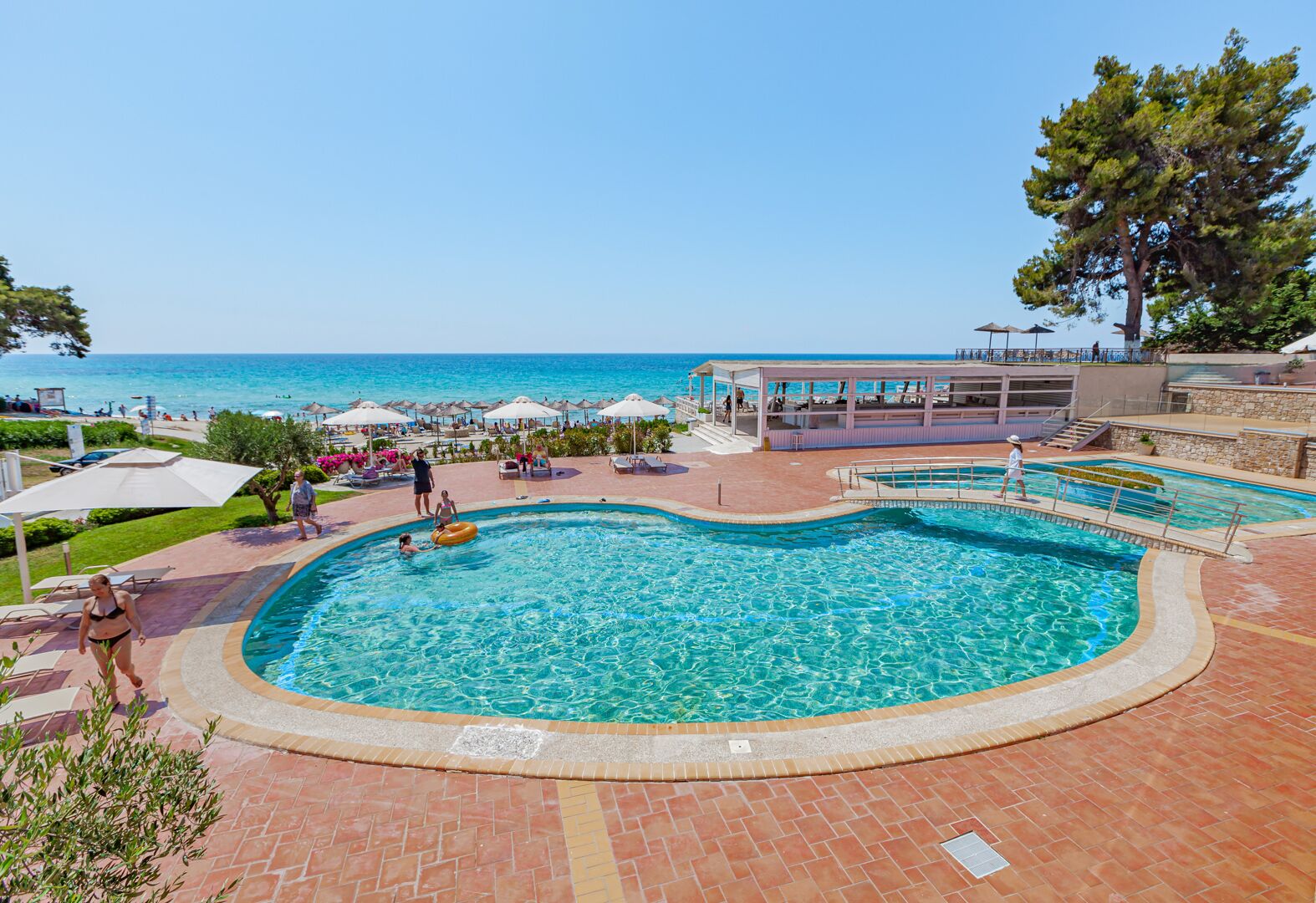 2 outdoor pools, open 10:00 am to 7:00 pm, pool umbrellas, pool loungers