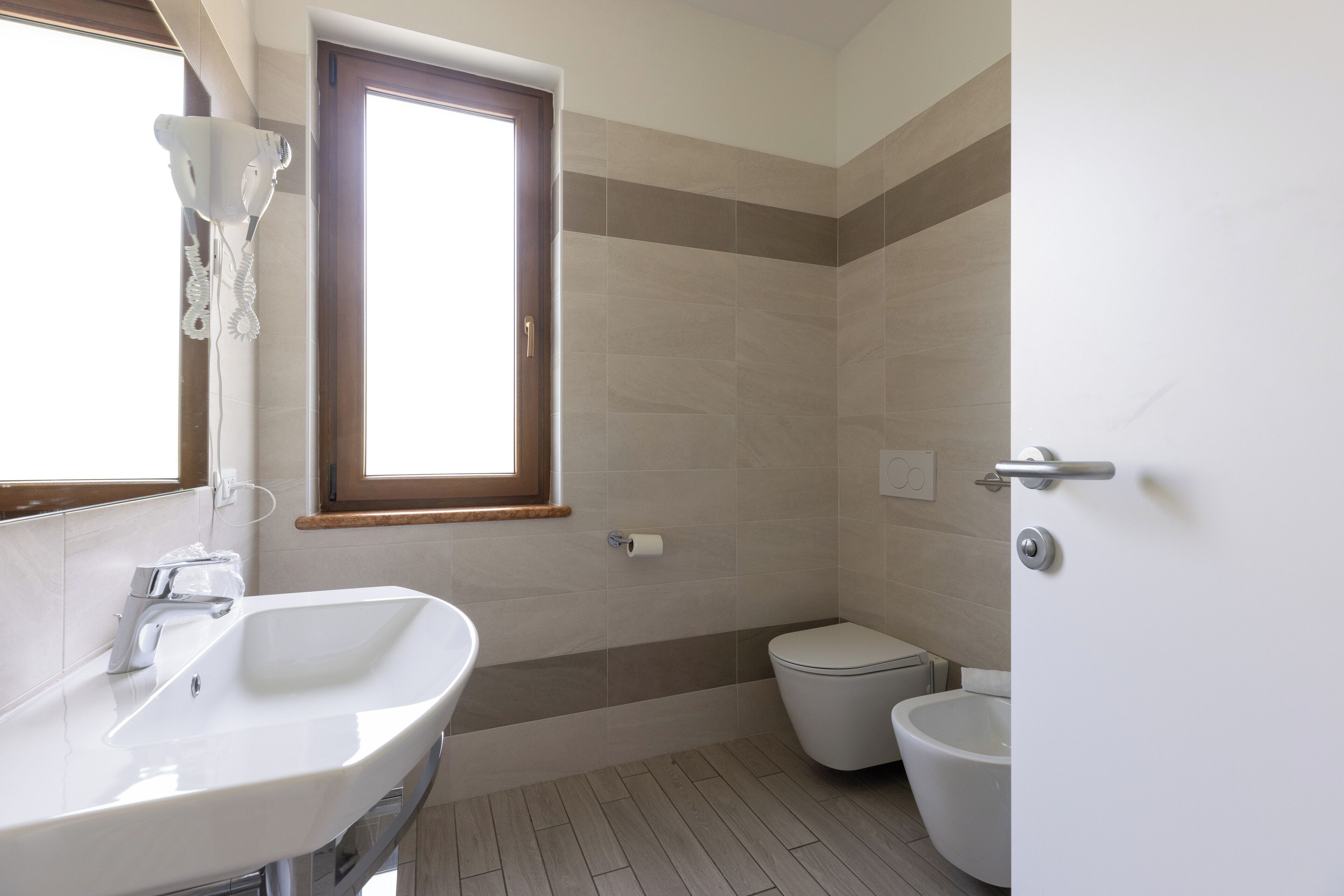 superior double or twin room | bathroom | shower, hair dryer, slippers, bidet