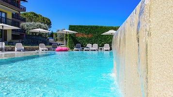 Seasonal outdoor pool, pool umbrellas, pool loungers