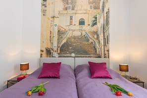One-Bedroom Apartment with Balcony | 1 bedroom, in-room safe, individually decorated, individually furnished
