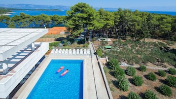 Relax by the pool and enjoy breathtaking views of the coastal landscape.