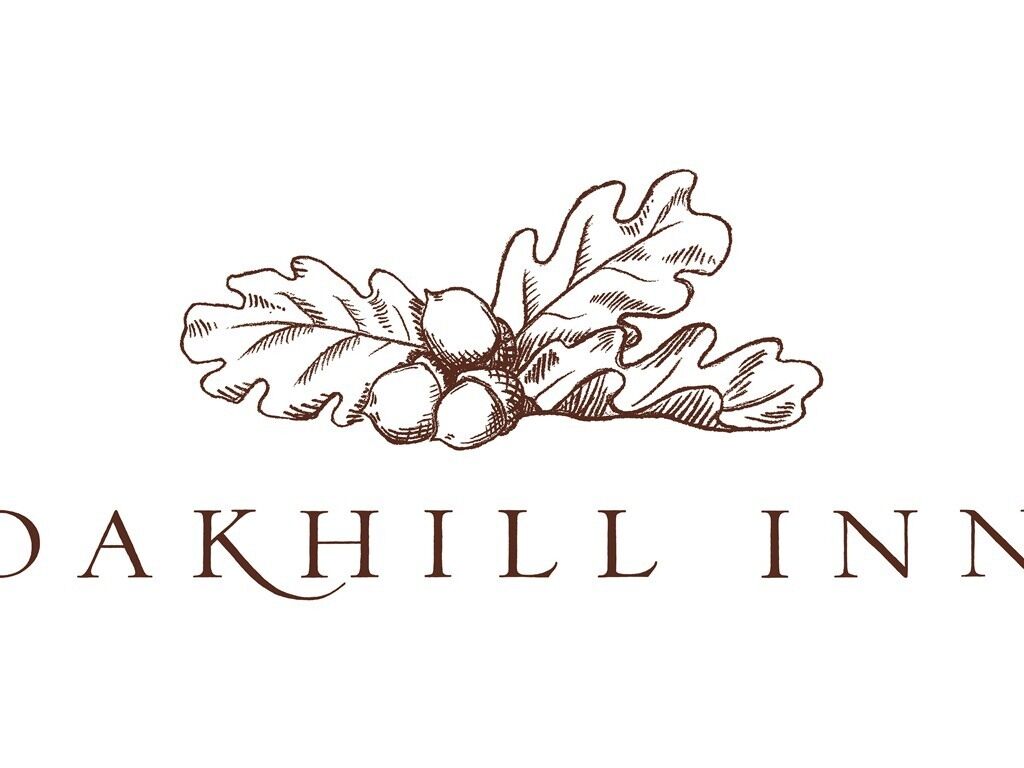 The logo of Oak Hill Inn, featuring a stylized oak leaf and acorns.