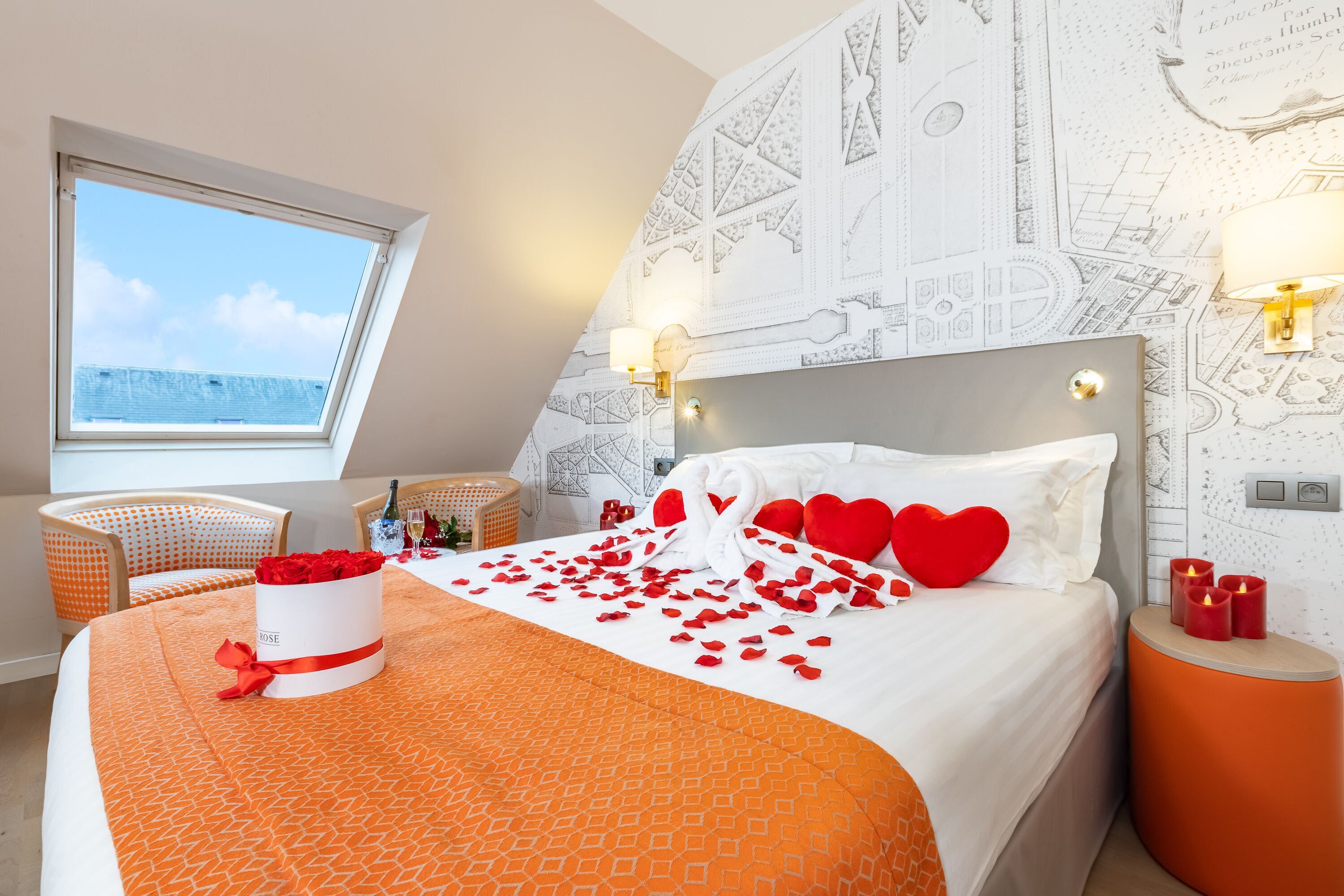 A bedroom with a large bed, a window, and a map-themed wall.