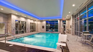 An indoor swimming pool with clear water, surrounded by marble walls and large windows. - Homewood Suites by Hilton Nashville Franklin Cool Springs (Franklin)