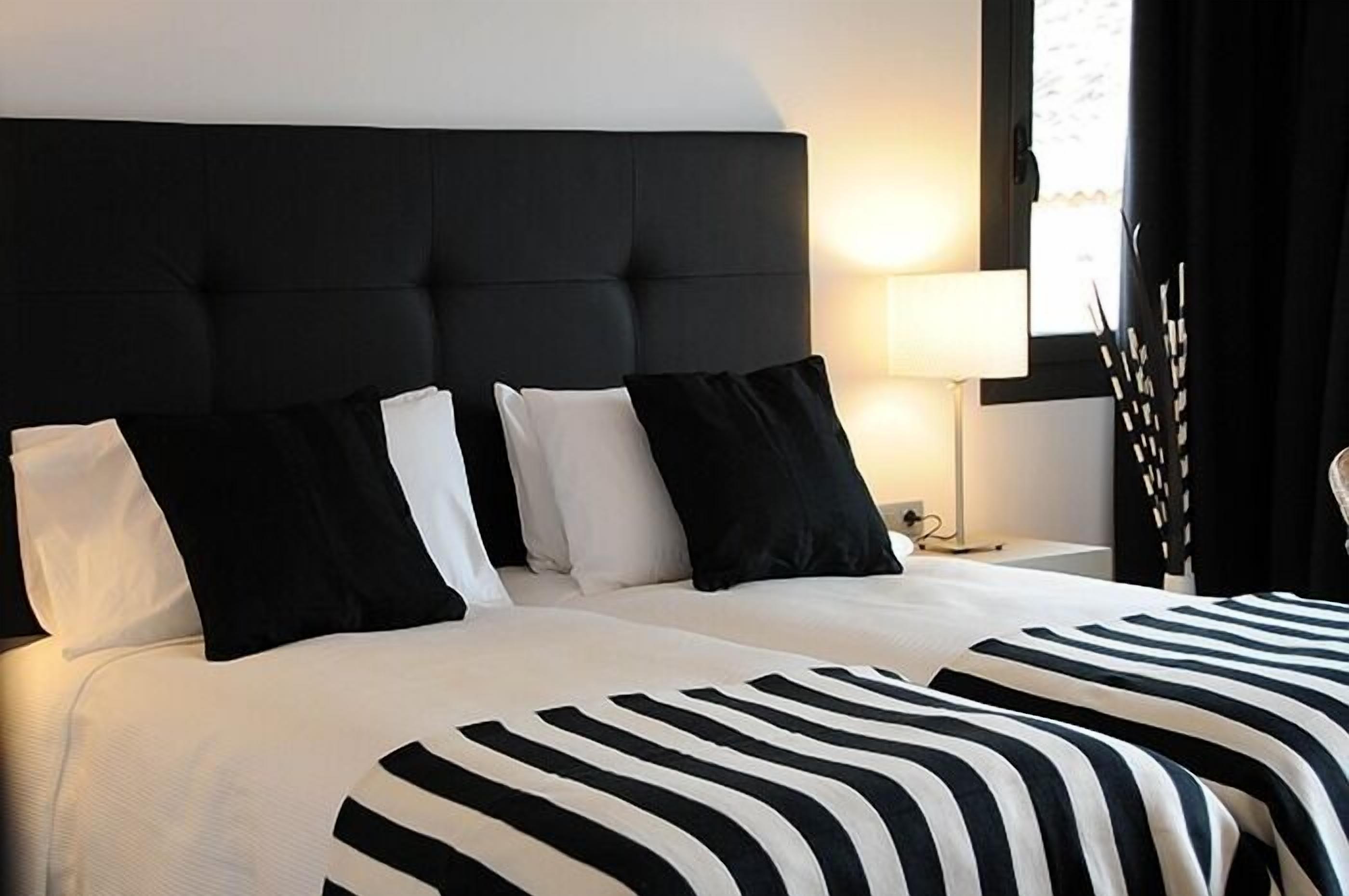 desk, blackout curtains, soundproofing, rollaway beds