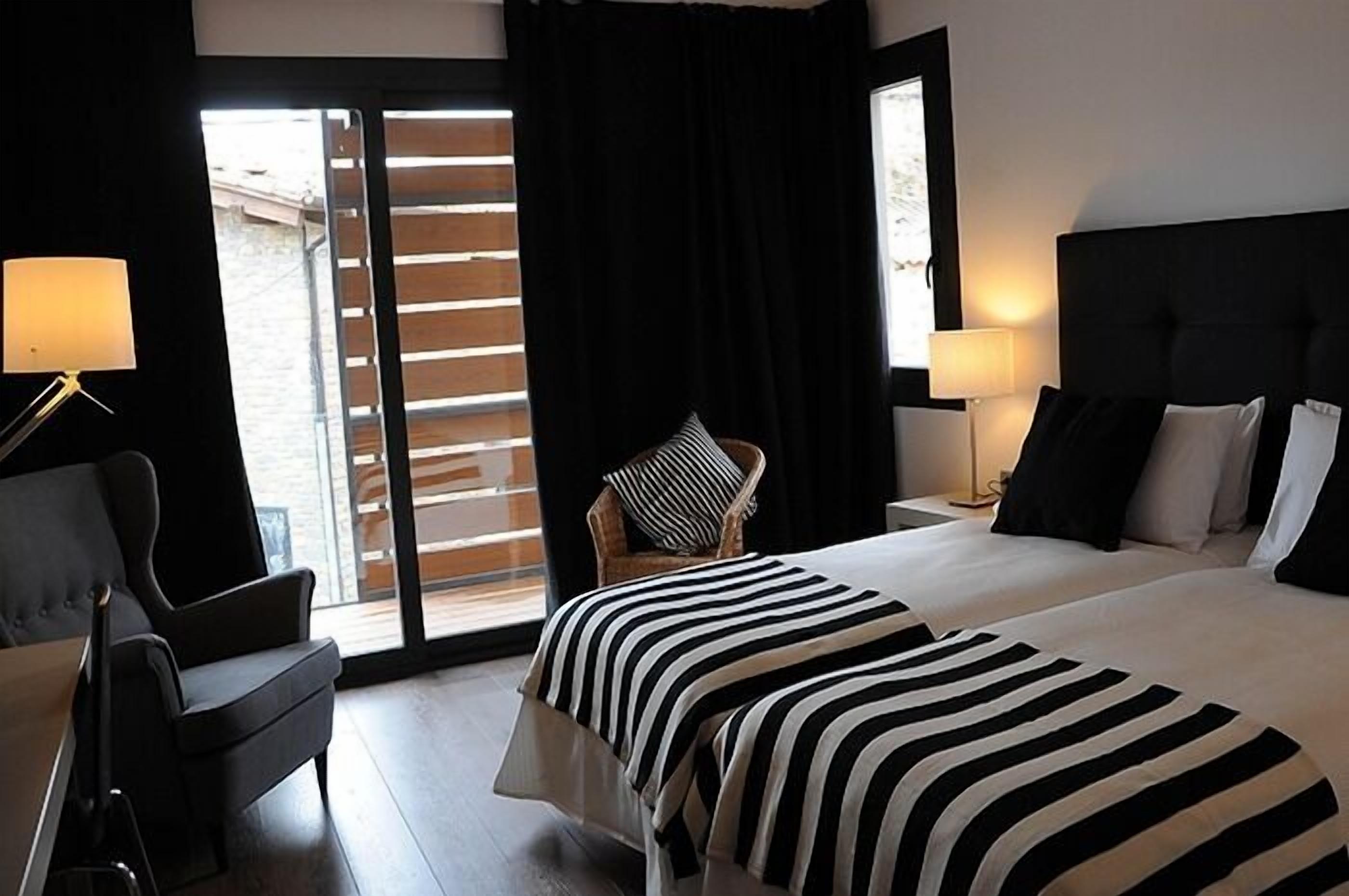 desk, blackout curtains, soundproofing, rollaway beds