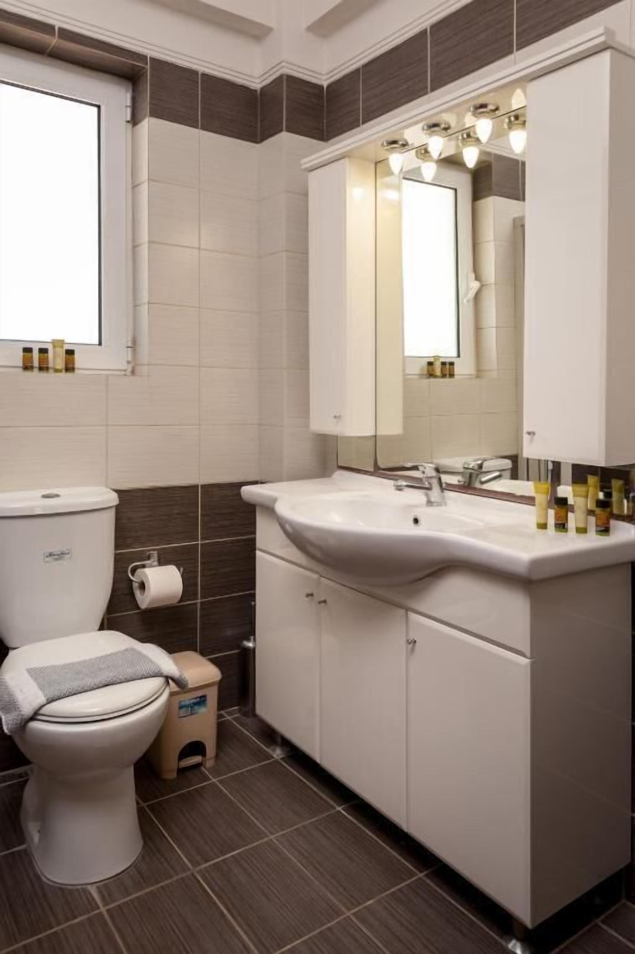 deluxe family suite | bathroom | deep-soaking bathtub, hair dryer, bathrobes, towels