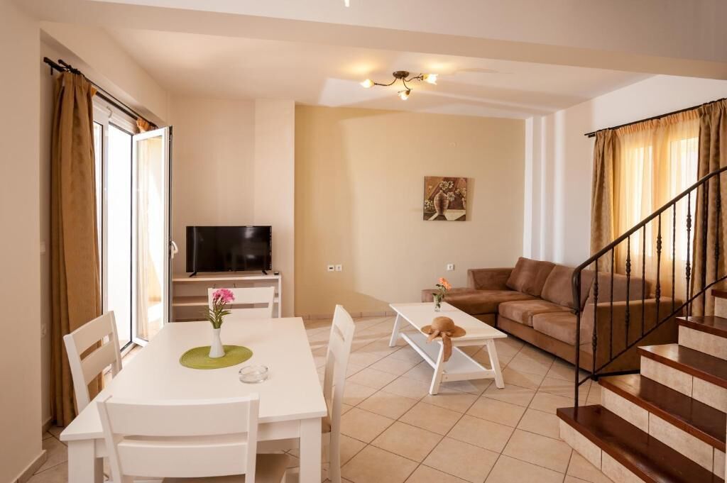 deluxe family suite | living area | 22-inch plasma tv with satellite channels, tv