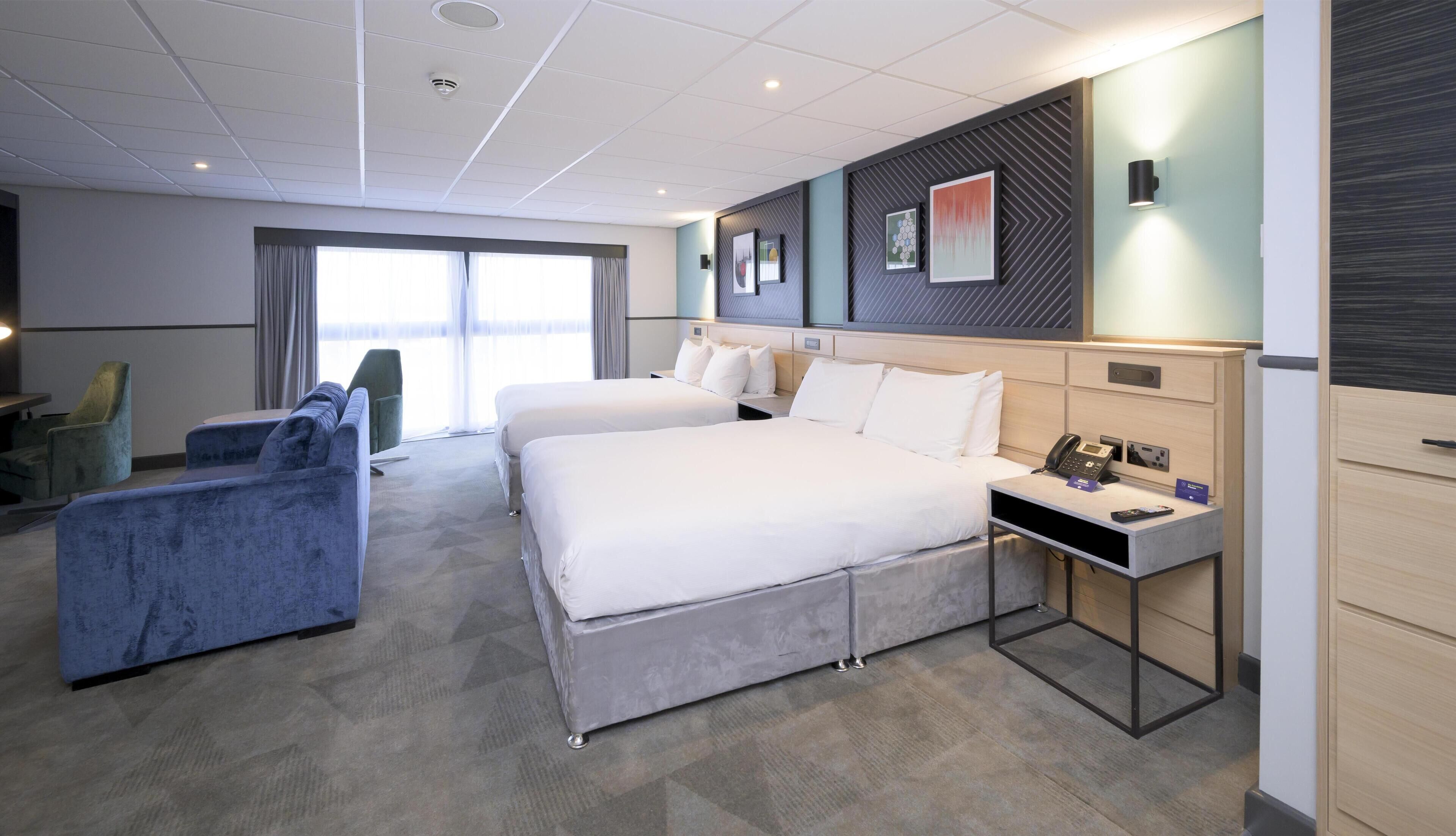 Deluxe Room, 2 Queen Beds | Living area | Flat-screen TV