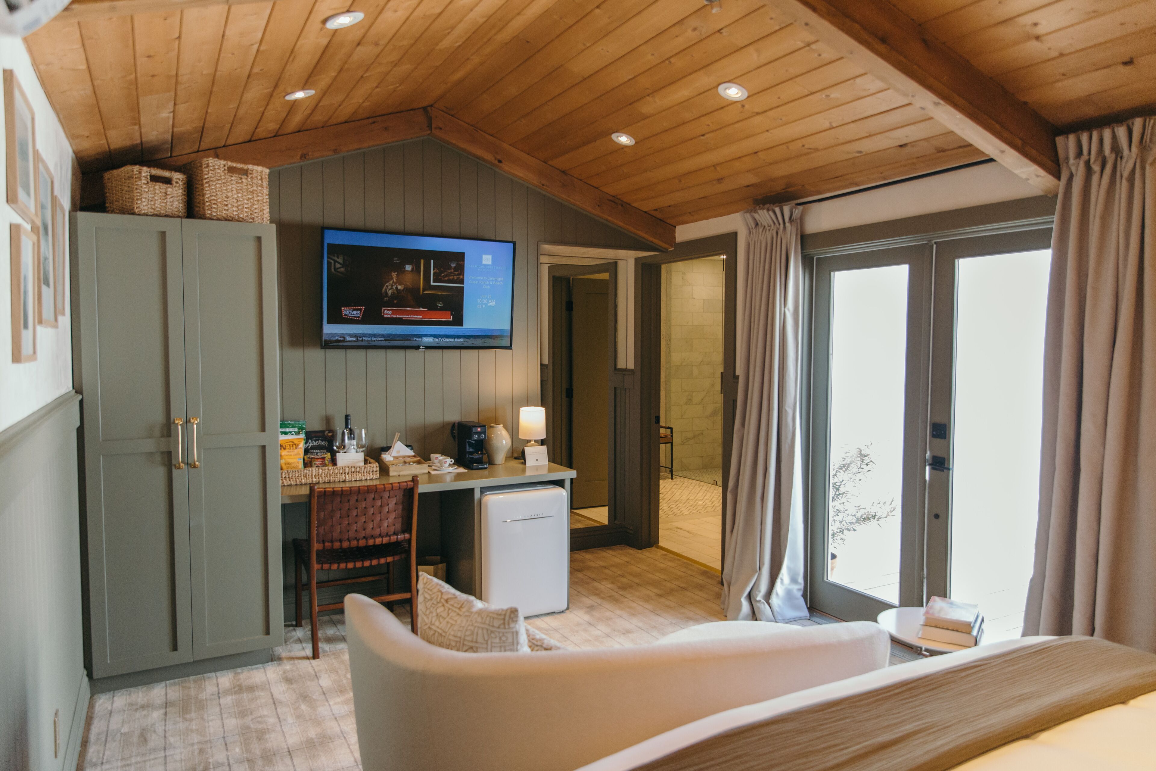 private cottage | living area | 60-inch flat-screen tv with cable channels, tv, pay films