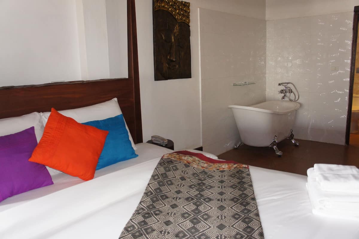 Deluxe Double Room with Balcony | In-room safe, individually decorated, desk, blackout drapes