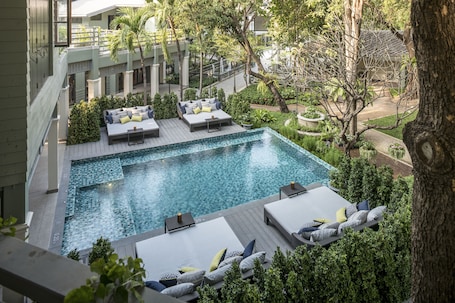 Outdoor pool, open 7:00 AM to 8:00 PM, pool loungers. The Raweekanlaya Hotel Bangkok