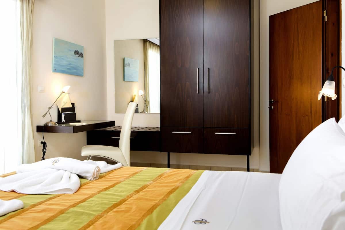 Apartment, 1 Bedroom, Sea View | 1 bedroom, in-room safe, desk, blackout curtains