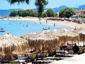 On the beach, sun-loungers, beach umbrellas, beach towels