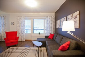 City Twin Room, 1 Bedroom, Sauna | Living room | Flat-screen TV - Kotimaailma Apartments Rovaniemi (Rovaniemi)