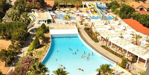 A resort with a large swimming pool, water slides, and sun loungers. - Serenis Hotel - All Inclusive (Manavgat)