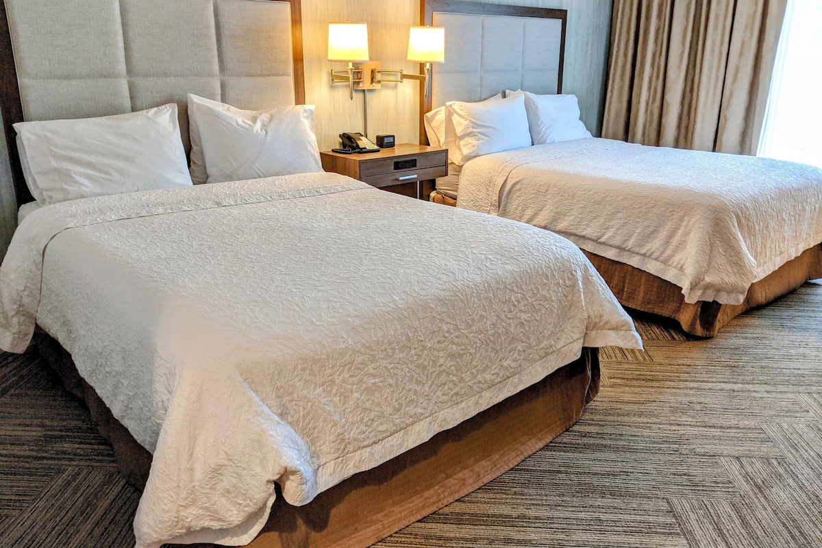 room, 2 queen beds, non smoking | in-room safe, free cots/infant beds, bed sheets