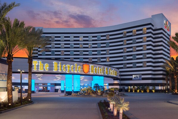 The Bicycle Hotel & Casino with a modern design, featuring a prominent entrance and a large illuminated sign. - Parkwest Bicycle Casino (Bell Gardens)