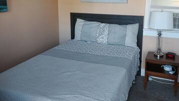 Room, 1 Queen Bed | Individually decorated, blackout drapes, free WiFi, bed sheets