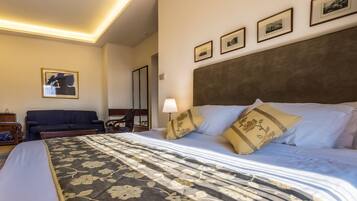 Executive Quadruple Room, City View | Minibar, in-room safe, free WiFi, bed sheets