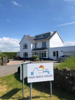 A two-story house with a sign indicating it is a B&B named 'HIGH WAYS HOUSE'. - High Ways House (Ilfracombe)