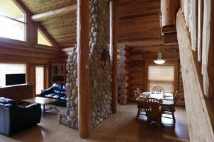 Three-Bedroom Executive Log Home | Living area | 32-inch LCD TV with satellite channels, books