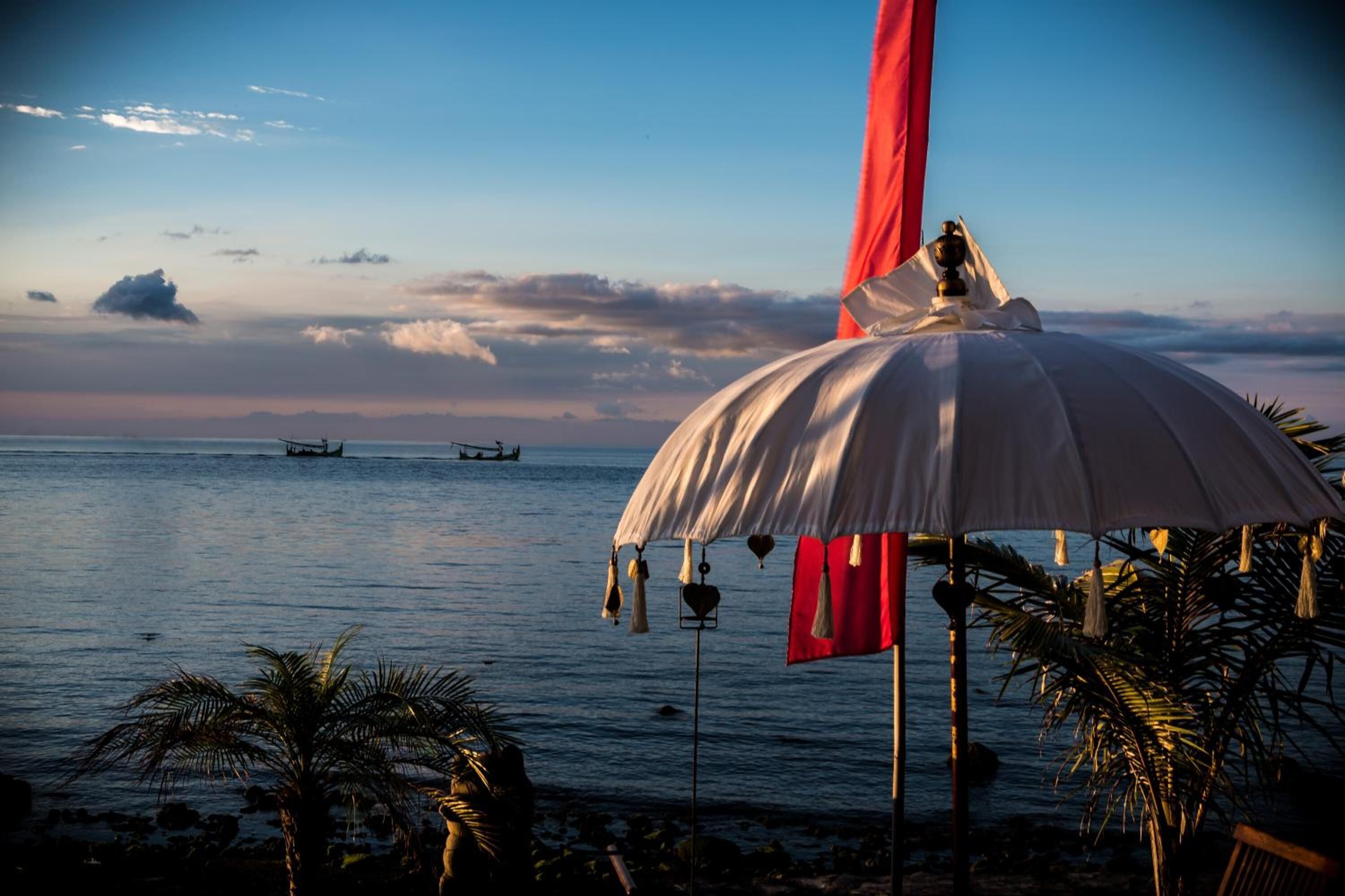 on the beach, sun-loungers, beach umbrellas, beach towels