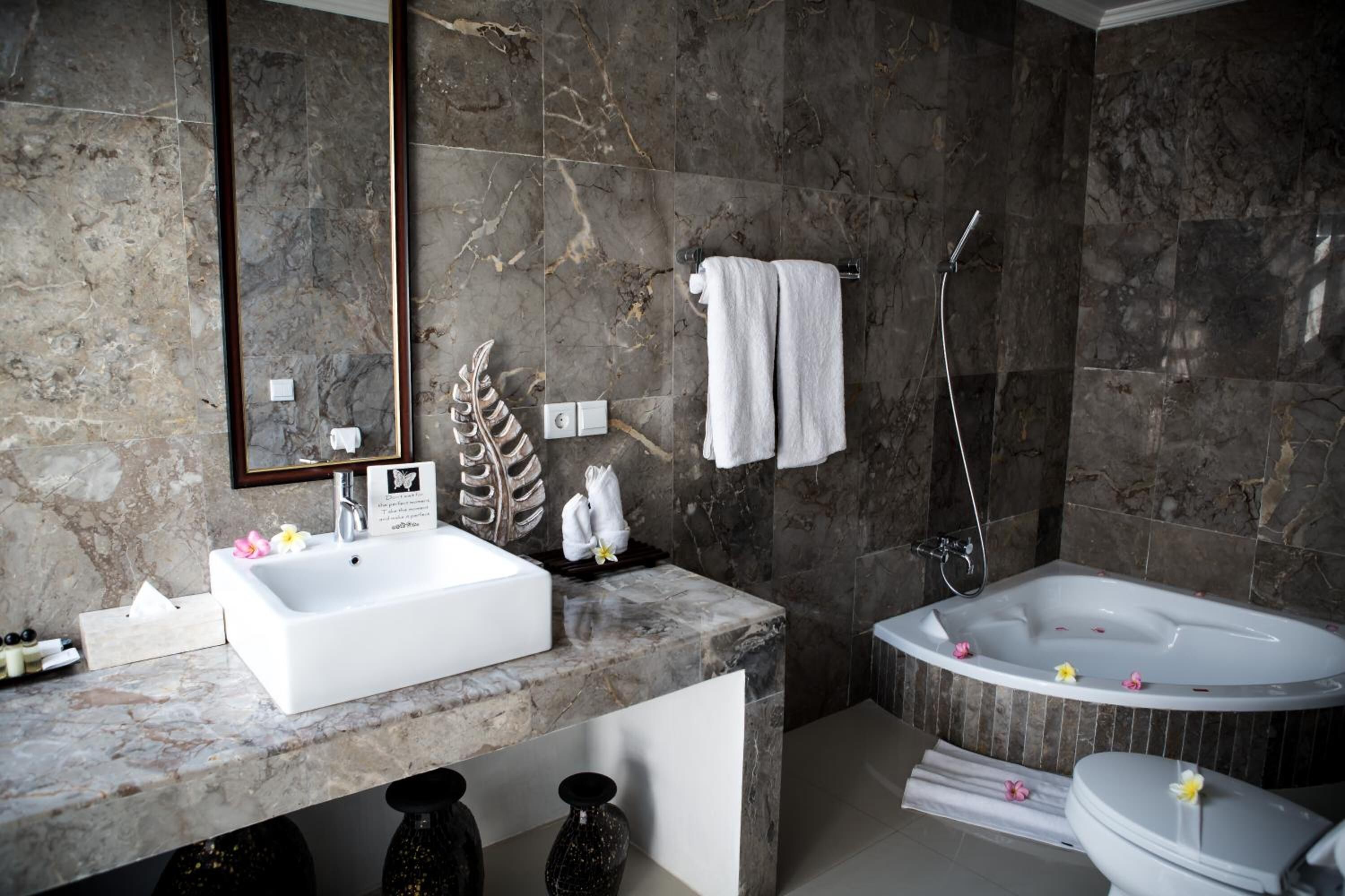 separate bathtub and shower, free toiletries, hair dryer, slippers