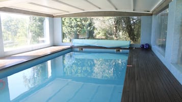 Indoor pool, outdoor pool, pool umbrellas, pool loungers