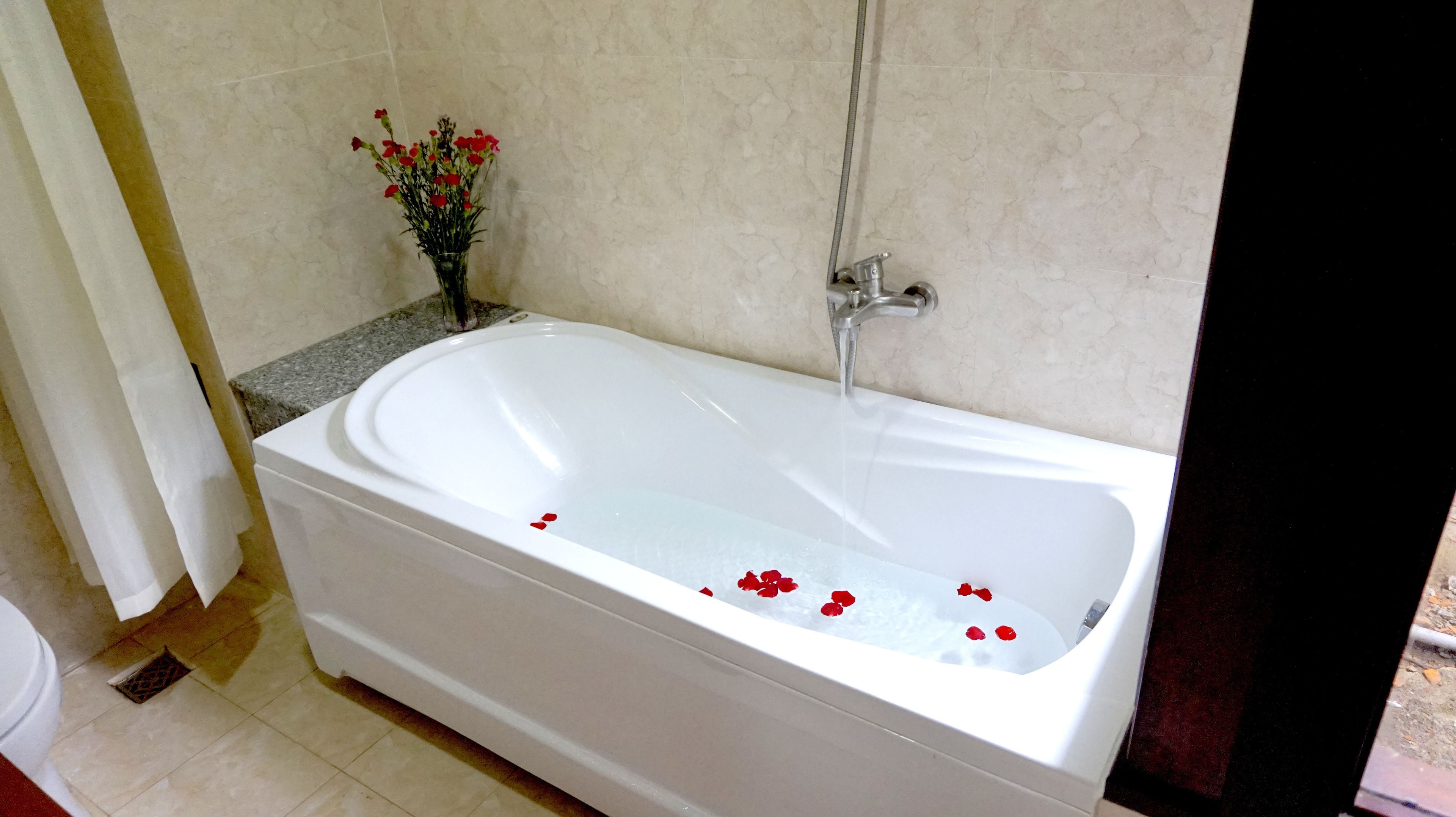 deep-soaking bathtub, rainfall showerhead, free toiletries, hair dryer