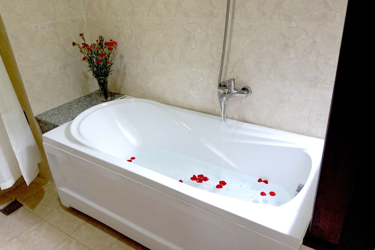 deep-soaking bathtub, rainfall showerhead, free toiletries, hair dryer