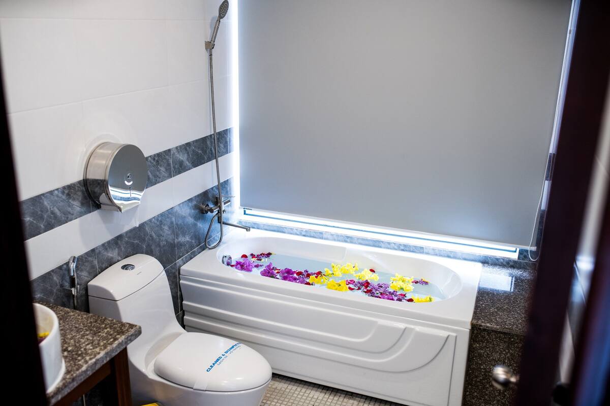deep-soaking bathtub, rainfall showerhead, free toiletries, hair dryer