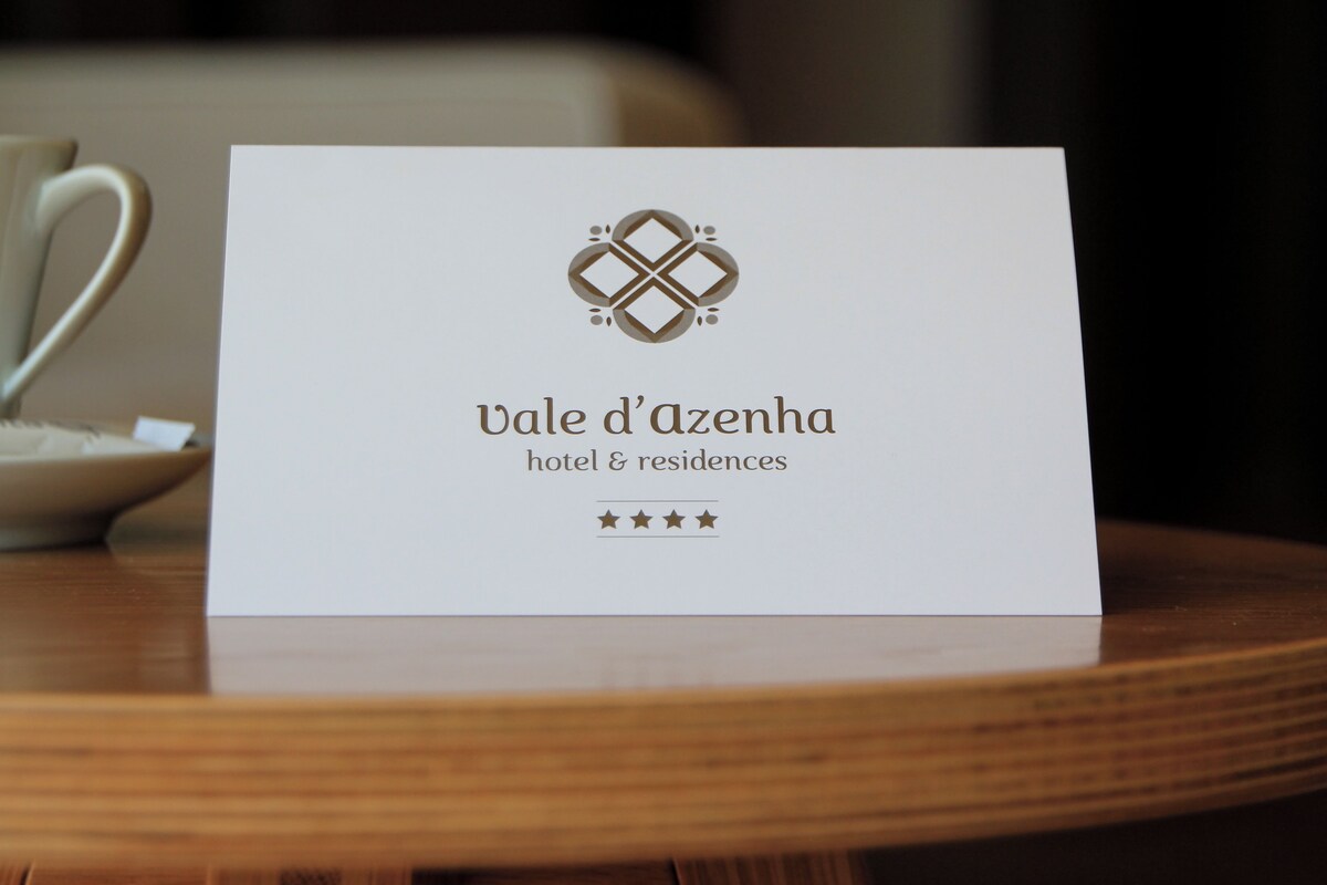 A business card for Vale d'Azenha hotel & residences with a logo and text.