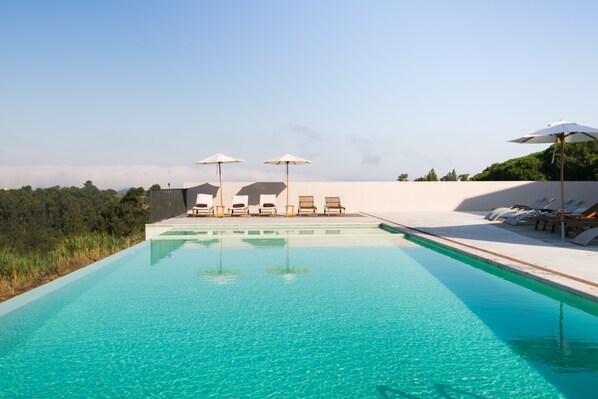 2 outdoor pools, pool umbrellas, pool loungers