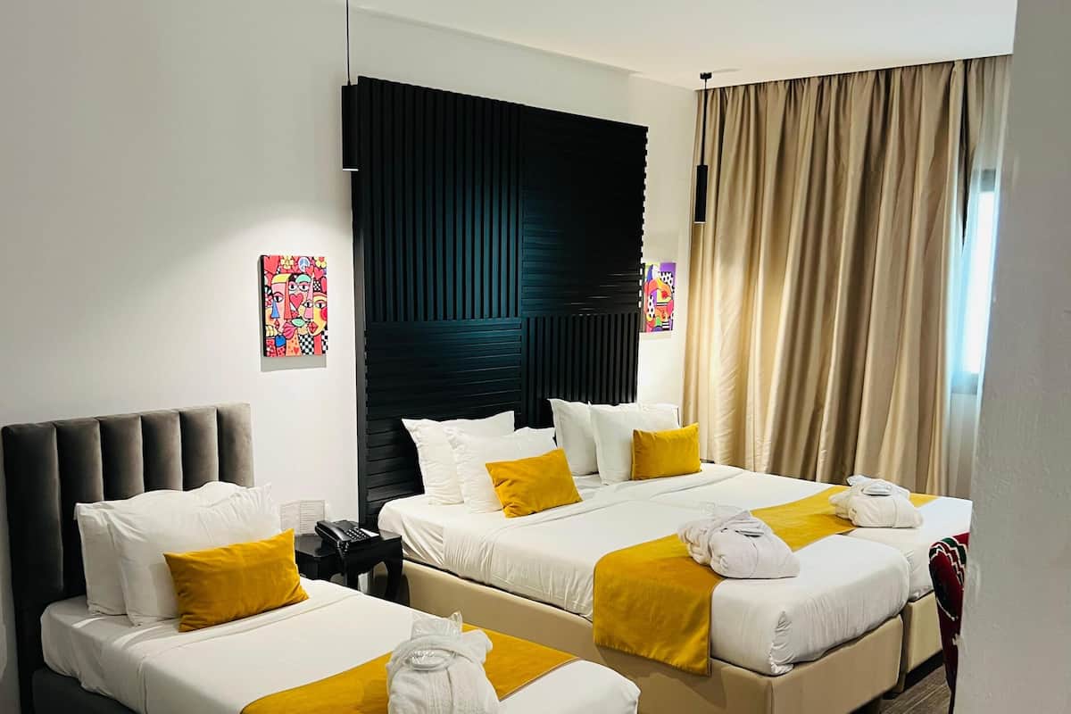 Comfort Triple Room | Minibar, in-room safe, blackout drapes, soundproofing