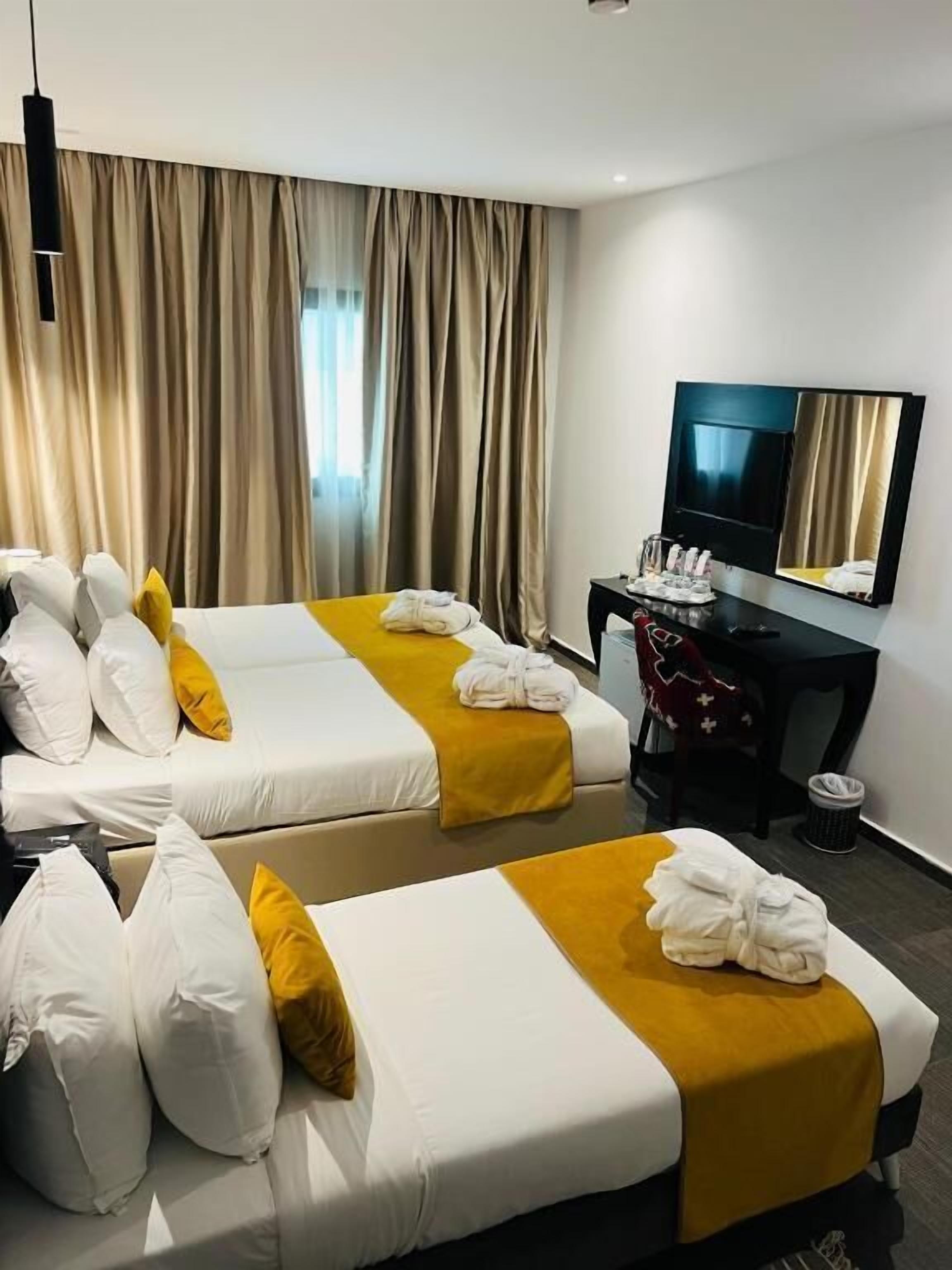 Comfort Triple Room | Minibar, in-room safe, blackout drapes, soundproofing