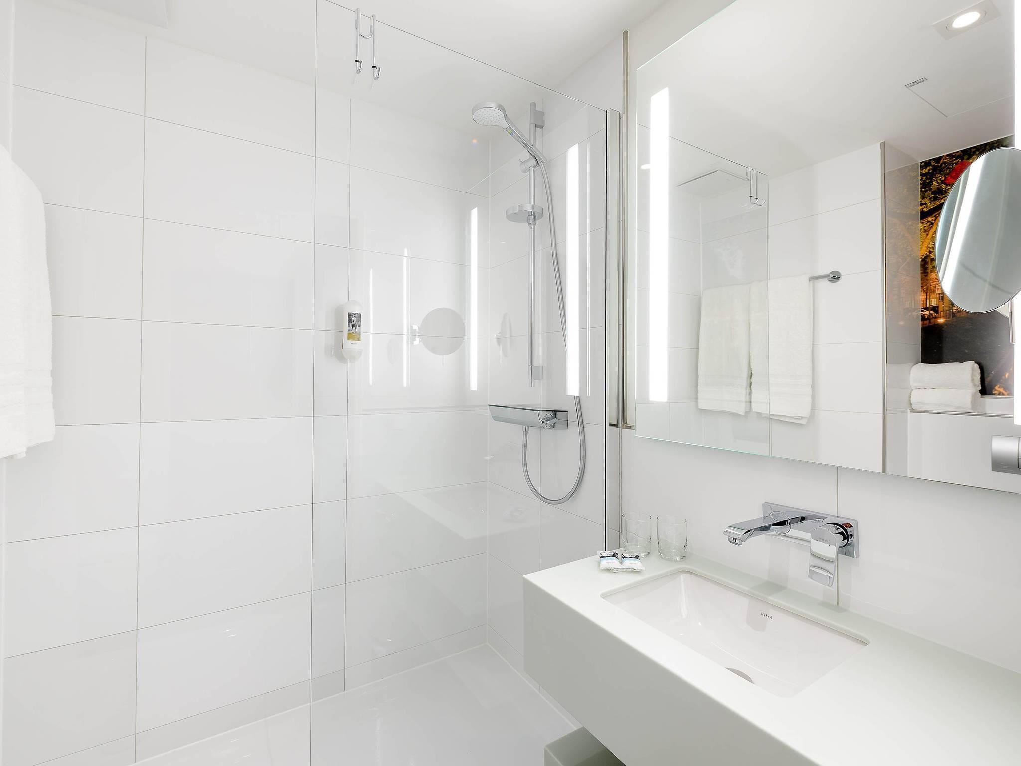 Shower, eco-friendly toiletries, hair dryer, towels