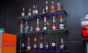 A bar with multiple shelves of liquor bottles. - Residency Hotel Lekki Lagos (Lekki)