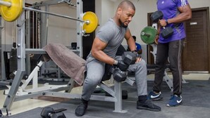 A gym with weightlifting equipment and a bench. - Residency Hotel Lekki Lagos (Lekki)