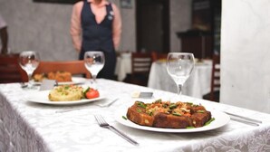 A dining table with plates of food, glasses, and cutlery. - Residency Hotel Lekki Lagos (Lekki)