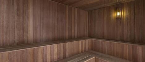 A sauna with wooden walls and benches.