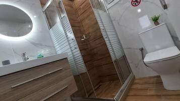 Apartment, 3 Bedrooms, Garden View | Bathroom | Shower, hair dryer, slippers, towels