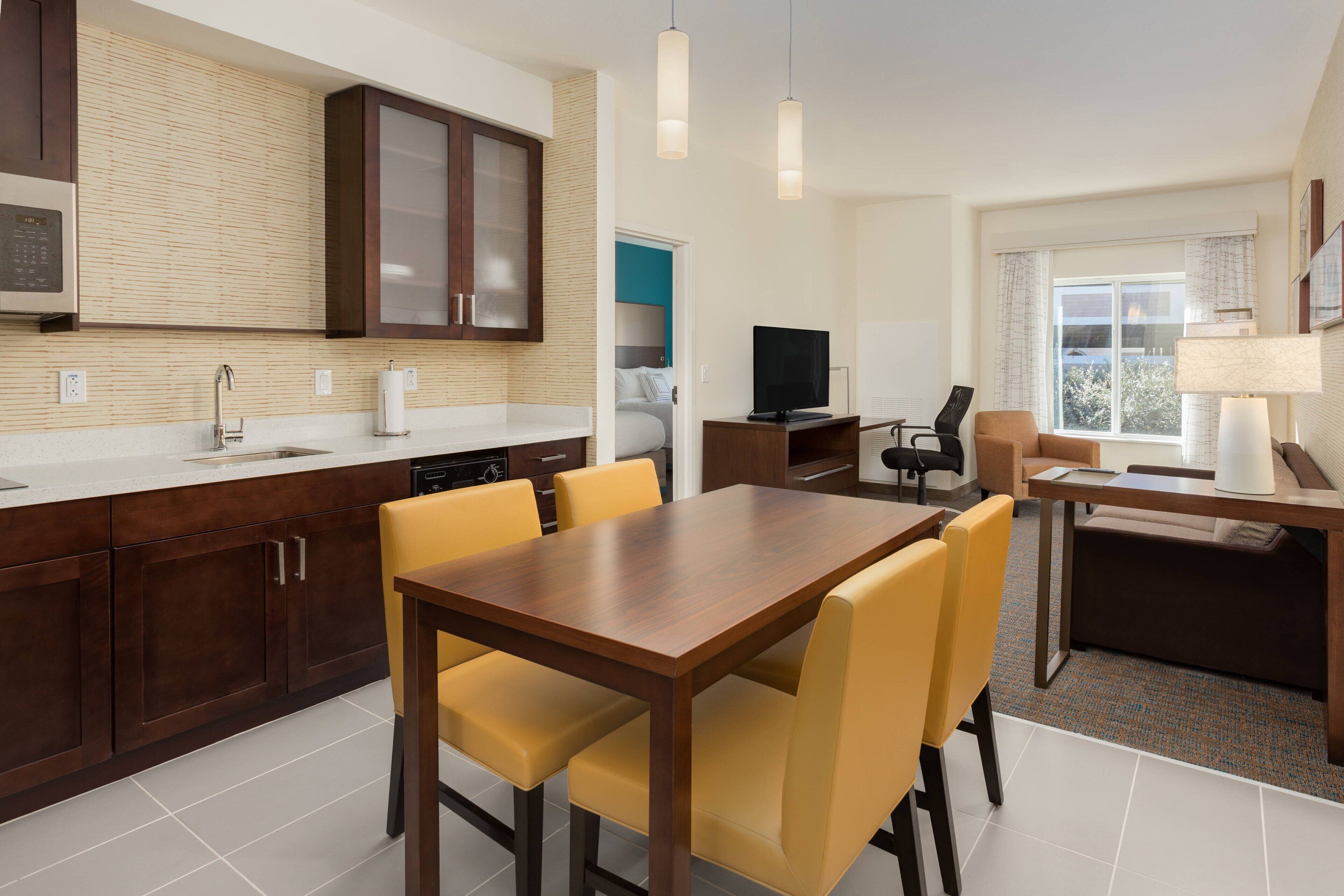 full-sized fridge, microwave, stovetop, dishwasher