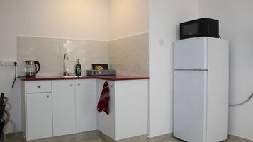 Apartment, 1 Bedroom | Private kitchenette | Full-sized fridge, microwave, stovetop, electric kettle