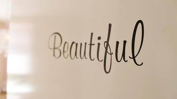 A wall with the word "Beautiful" written in cursive.