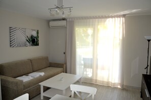 Superior Apartment, 1 Bedroom | Living area | 32-inch flat-screen TV with satellite channels, TV - Kione Playa Romana (Alcala de Xivert)