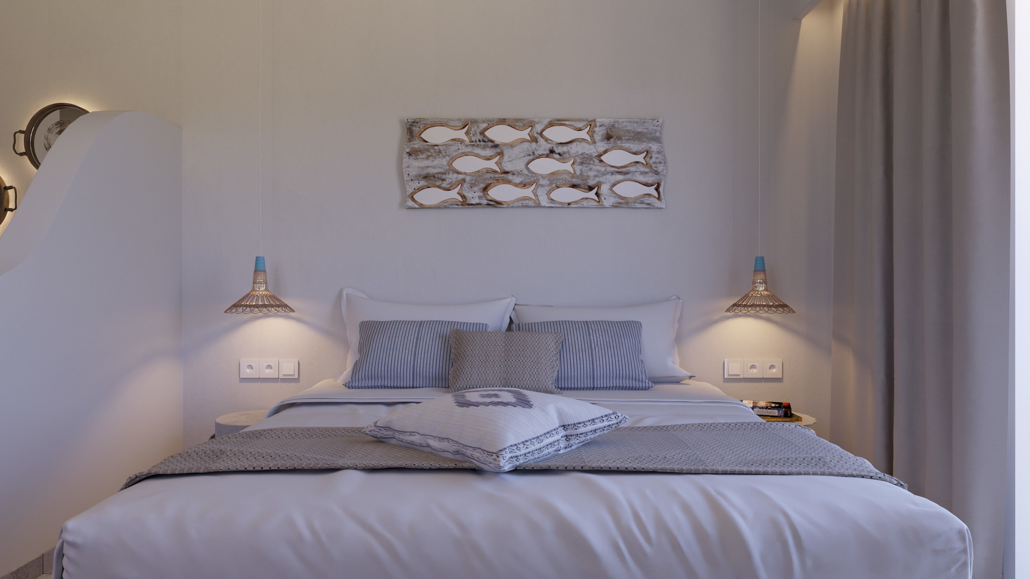 A neatly made bed with a patterned bedspread, two bedside lamps, and a wall-mounted artwork.
