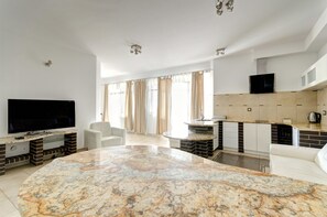 Studio, Balcony (for 4 adults ) | Living room | 40-inch flat-screen TV with cable channels, LCD TV