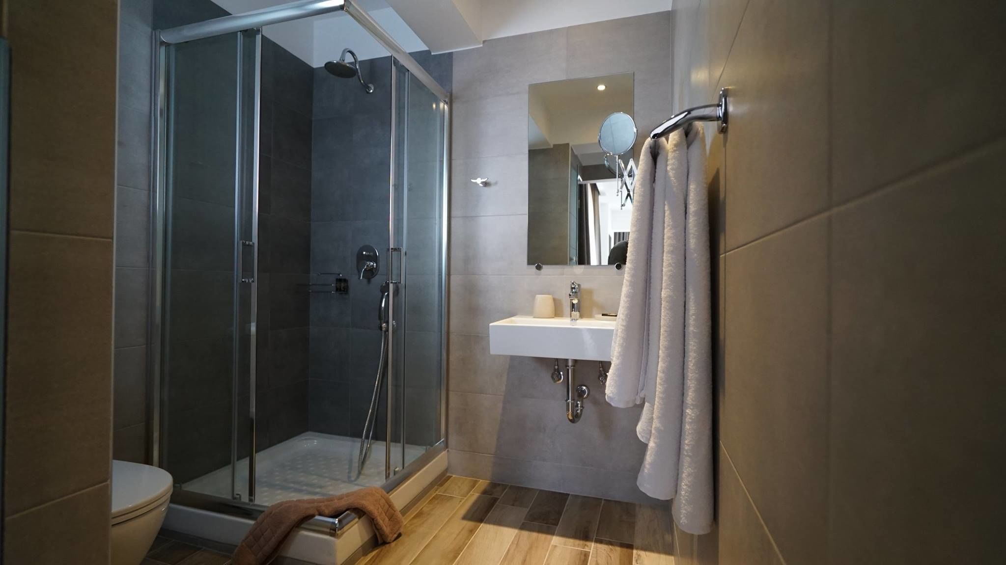 superior room | bathroom | shower, designer toiletries, hair dryer, towels
