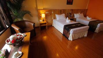 Deluxe Room | Minibar, desk, blackout curtains, iron/ironing board